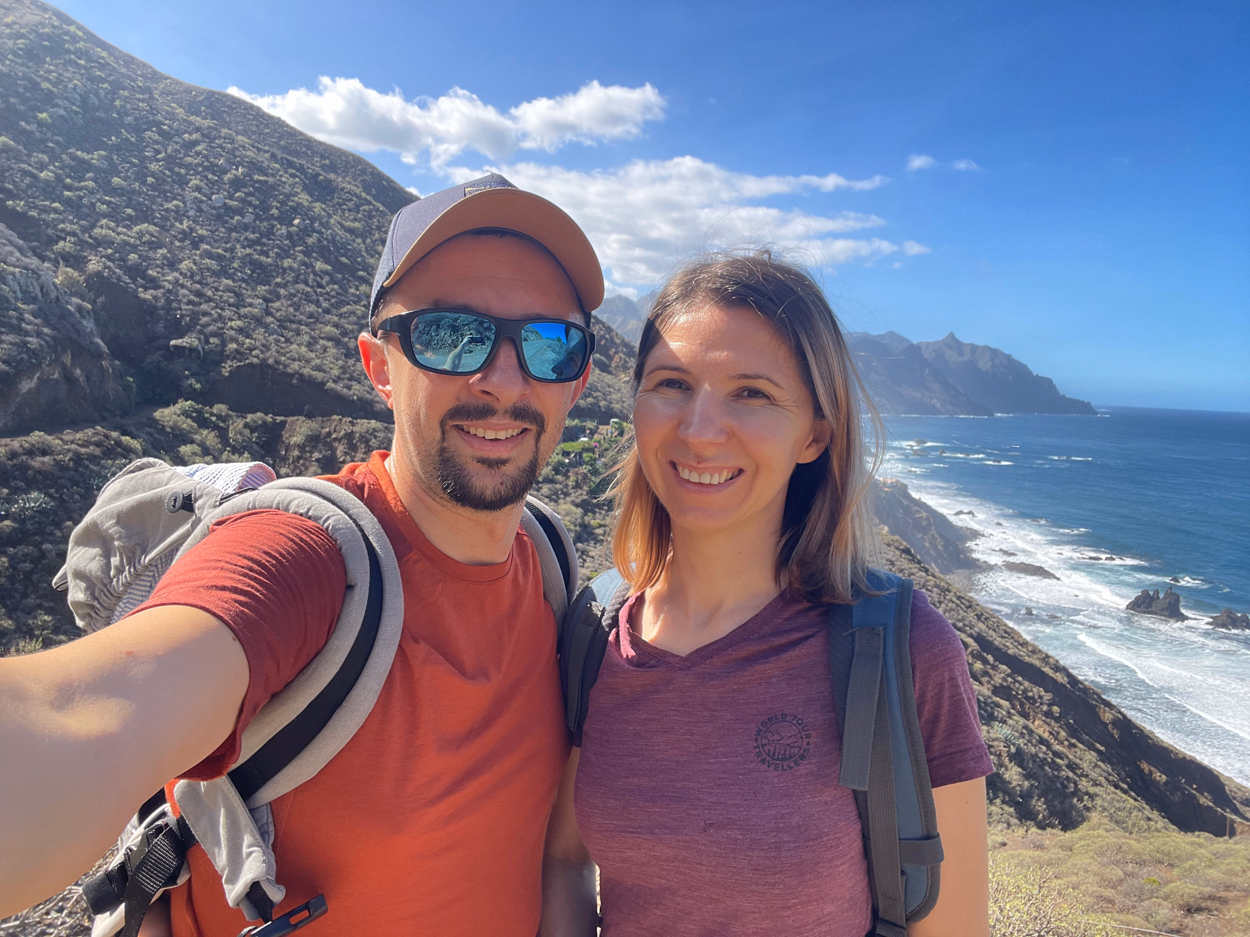 Alex and Mela on a hillside overlooking the coast