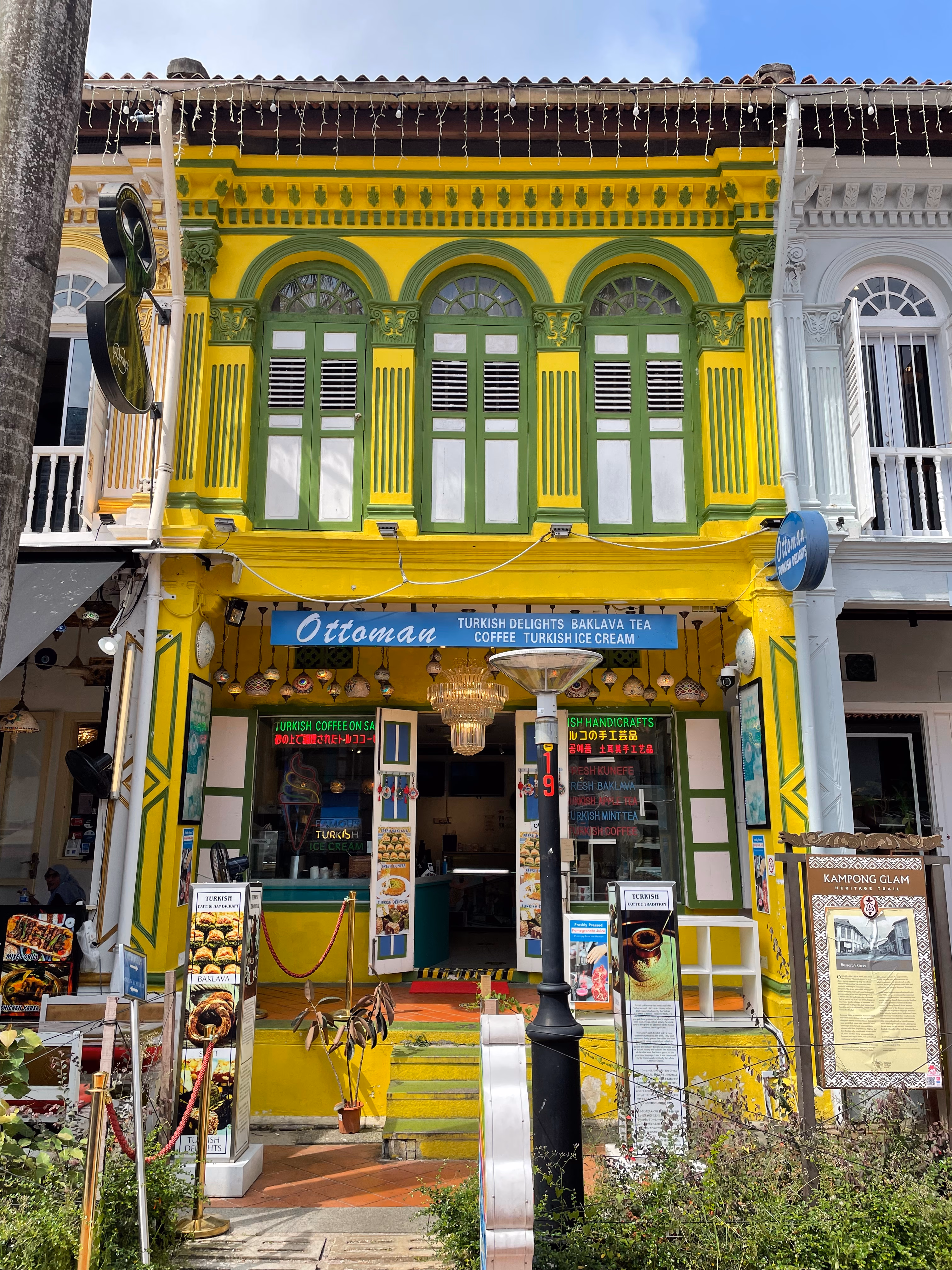 A bright yellow and green shophouse in Kampong Glam housing a Turkish café.