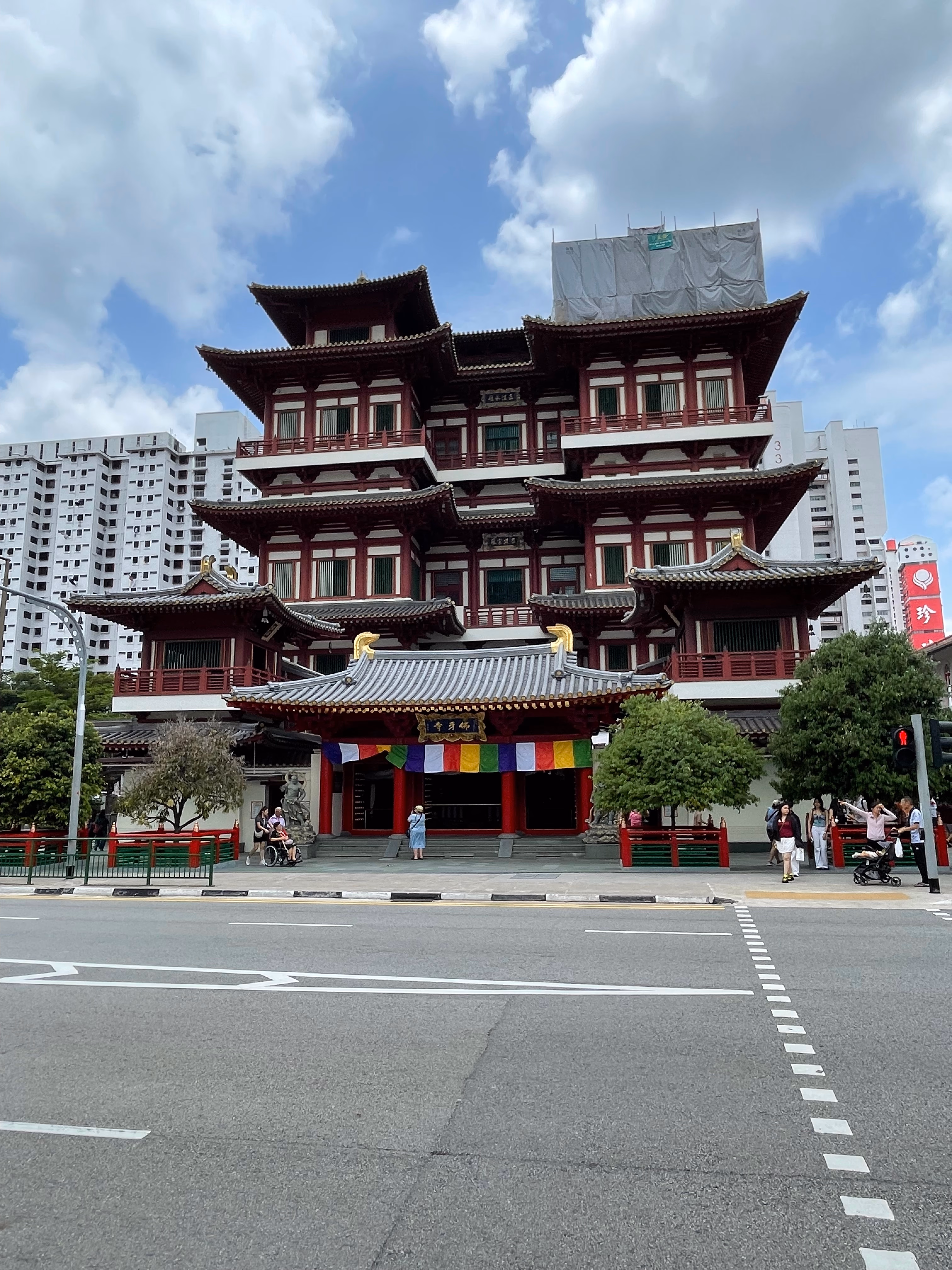 A tall red multi-tiered Chinese temple in Chinatown, Singapore.