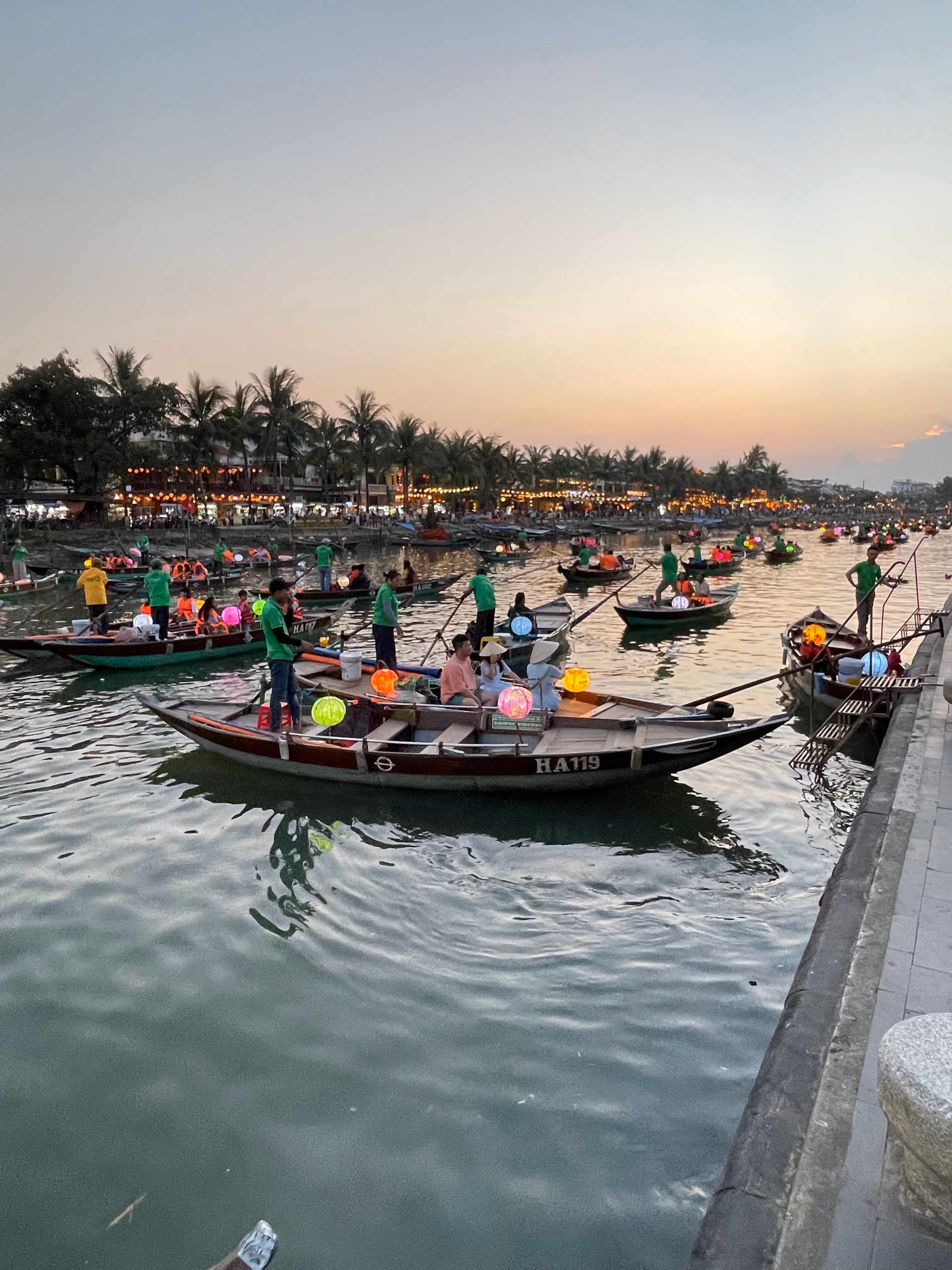 Lantern boats on the Thu Bon River at dusk in Hoi An.