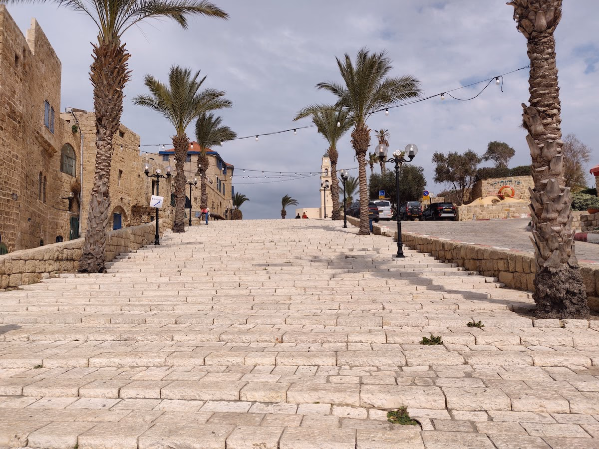 Sandstone stairs that lead to a plaza