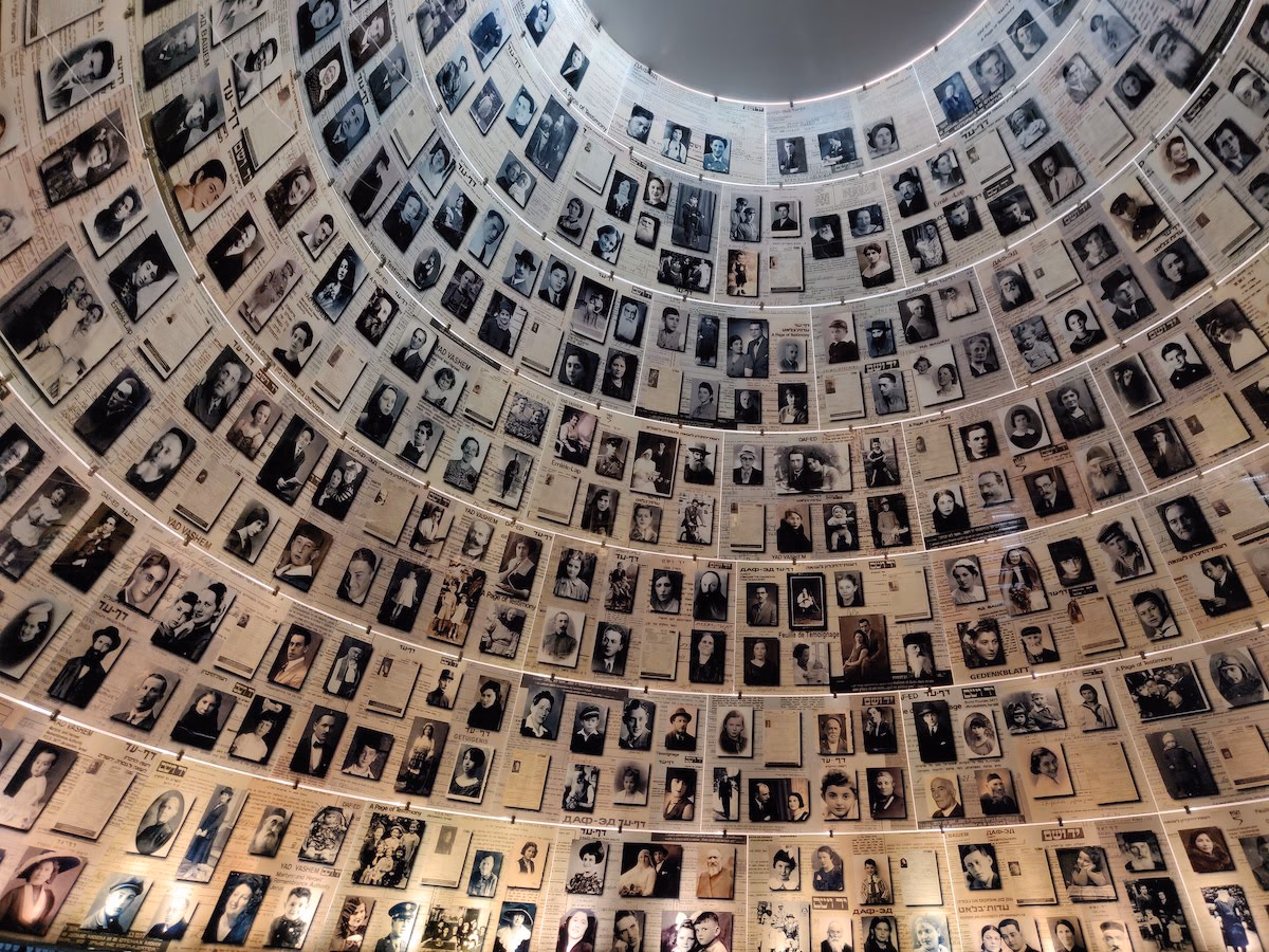 Circular dome interior with hundreds of images of victims of the Holocaust