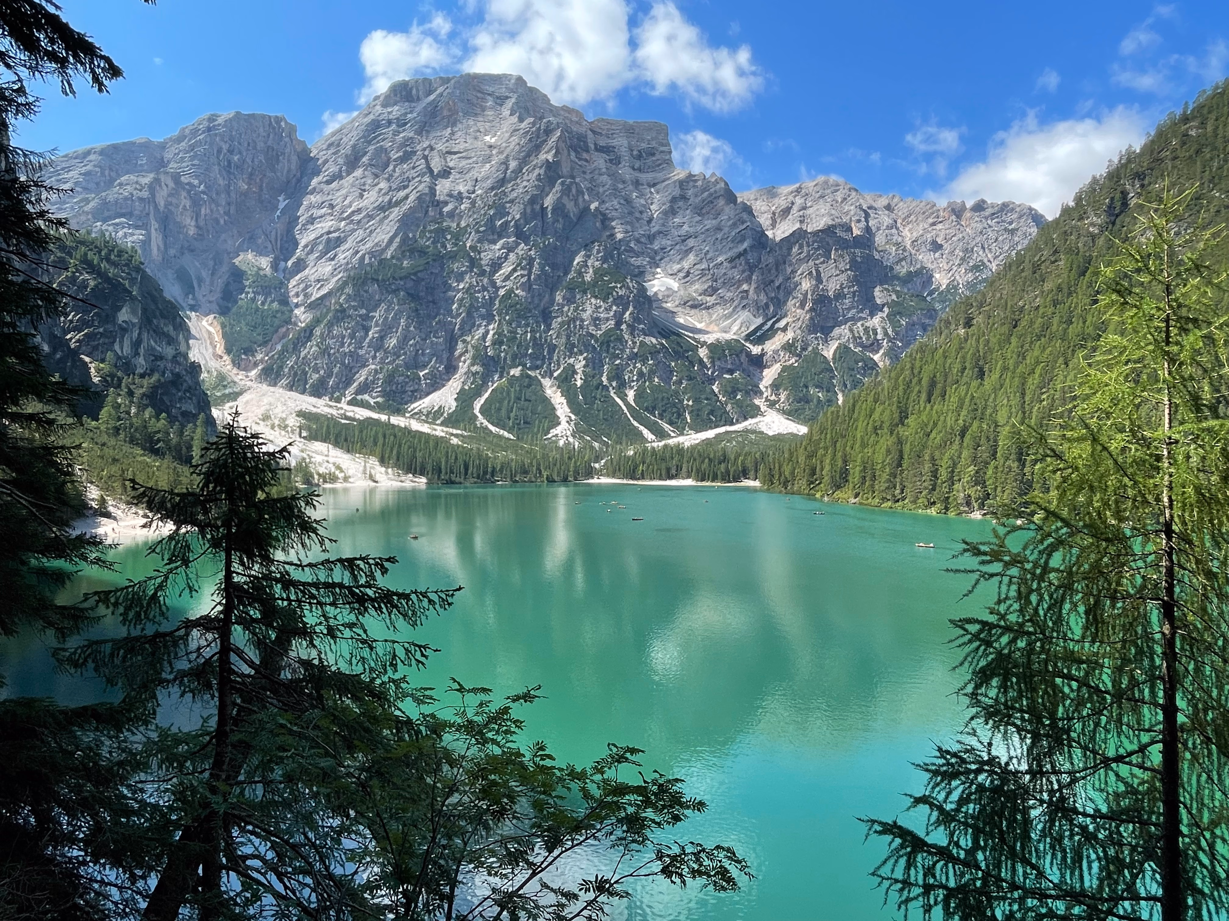 Lago di Braies with turquoise water and mountain cliffs
