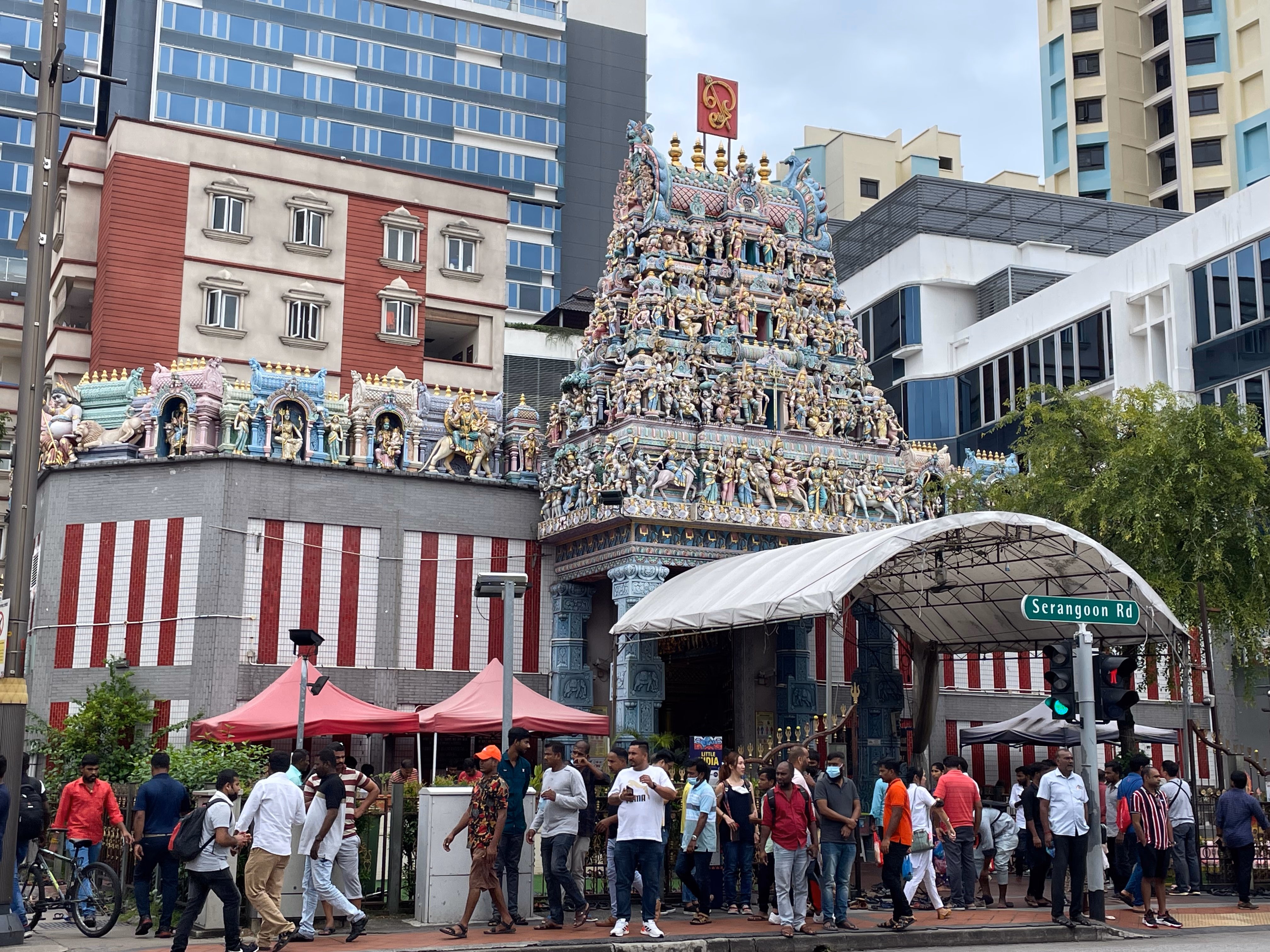 A colourful Hindu temple tower covered in sculpted figures on Serangoon Road.