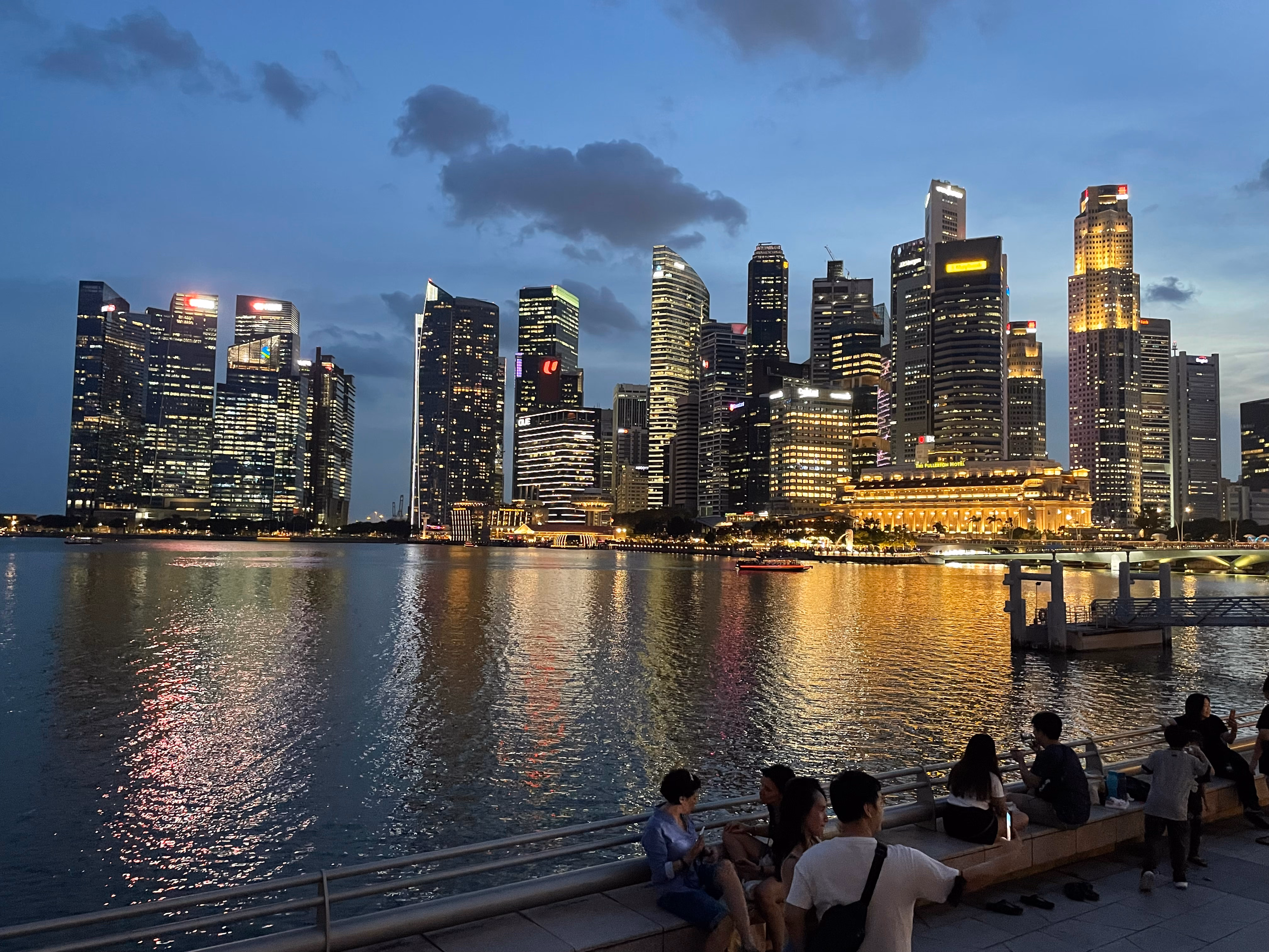 The view of the skyline of Singapore at night from Marina Bay.