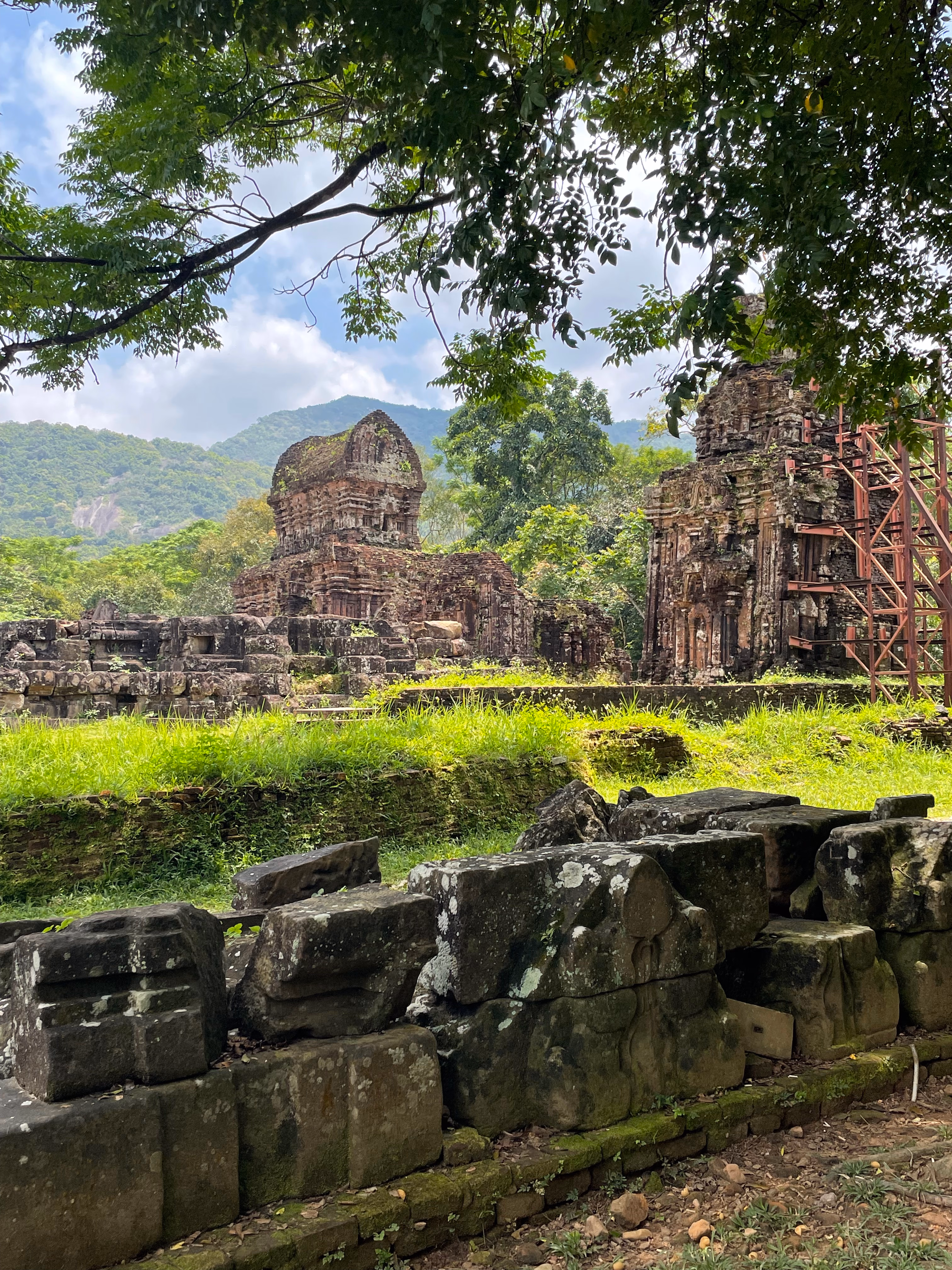 Cham temple ruins framed by trees at My Son.
