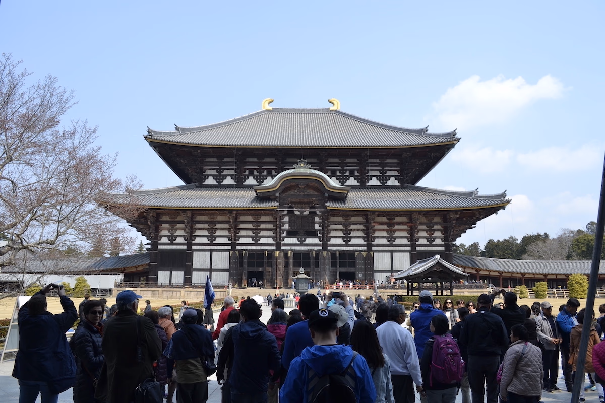 Japanese temple with a group of people in the foreground