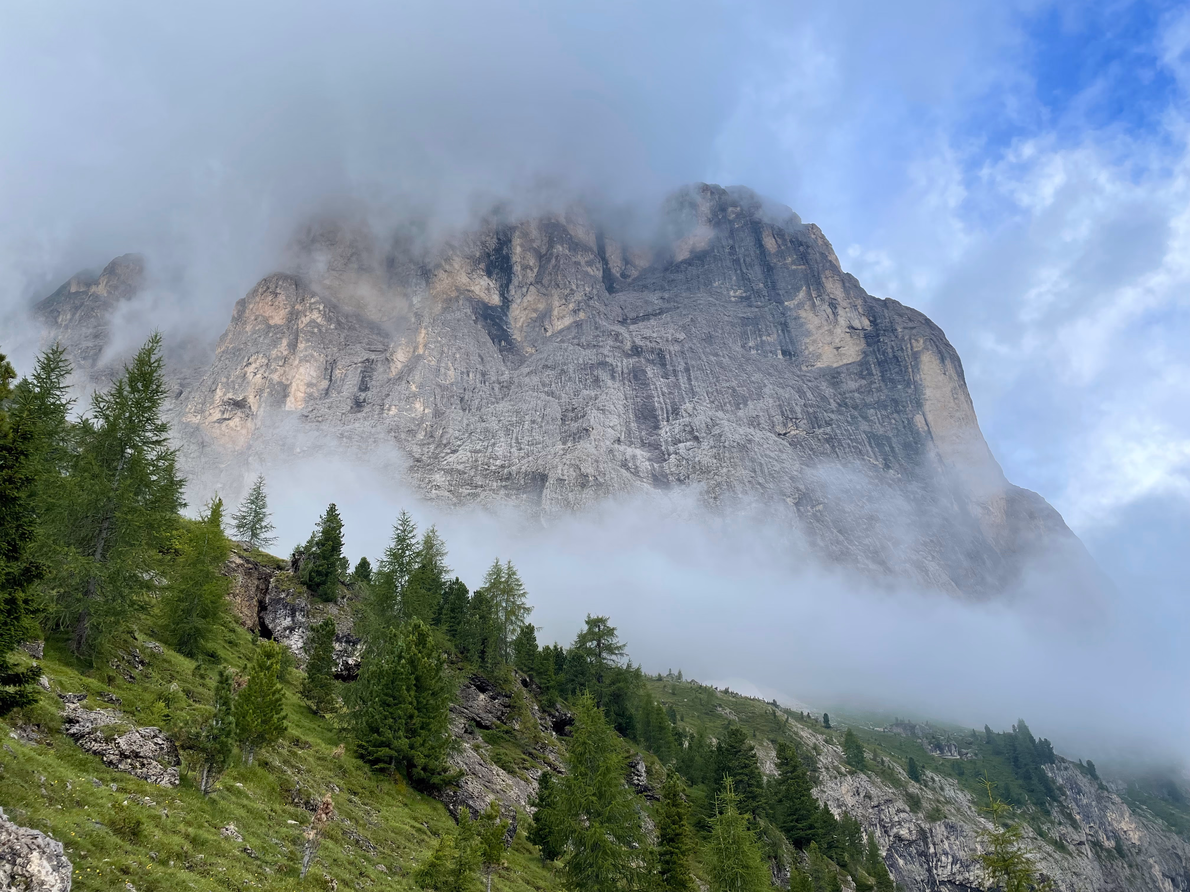 Sassolungo massif under the clouds