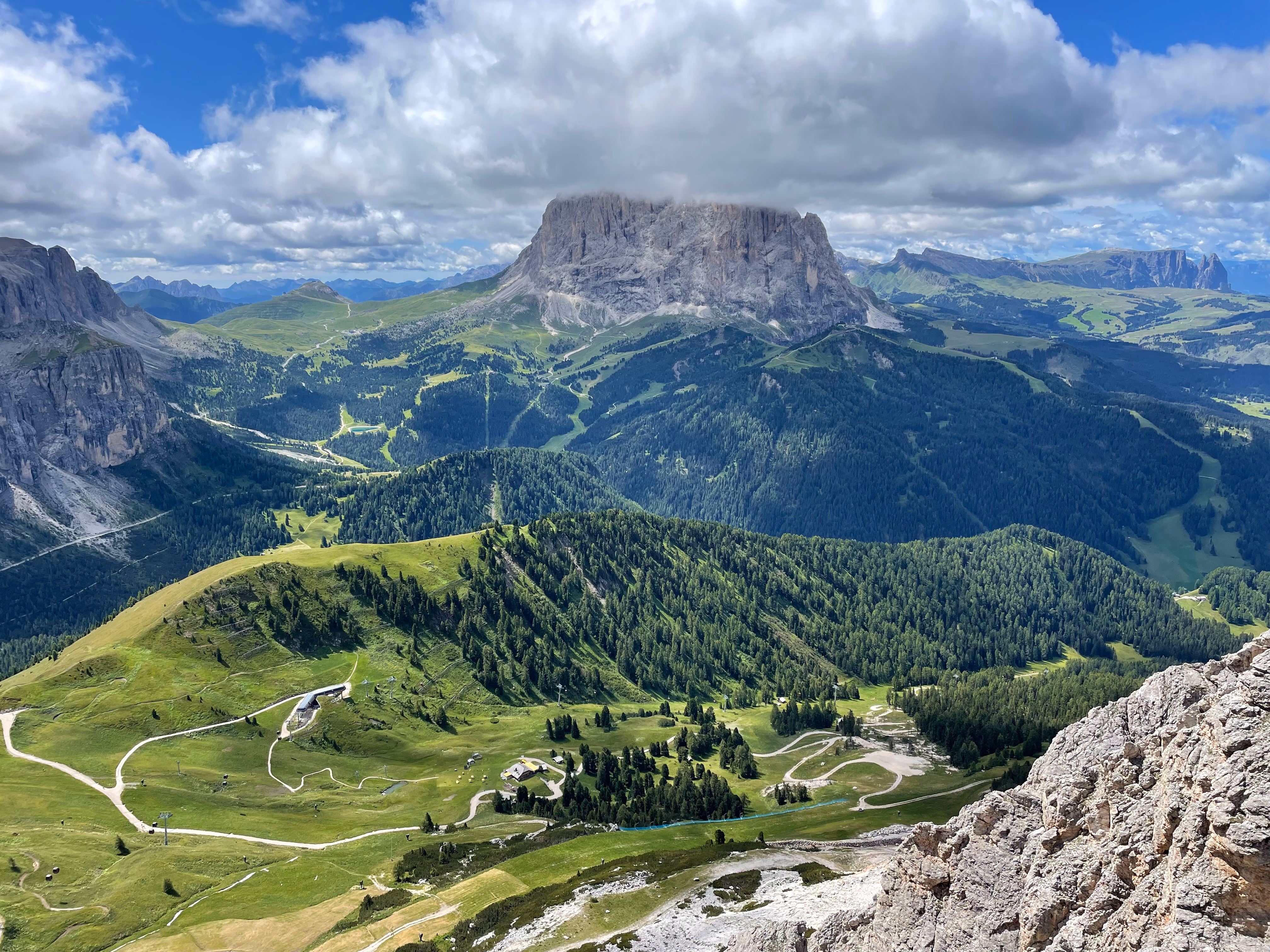 Green valley with rocky mountains in the background